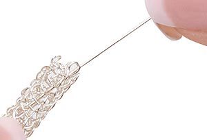 Wire being inserted into the knit tube